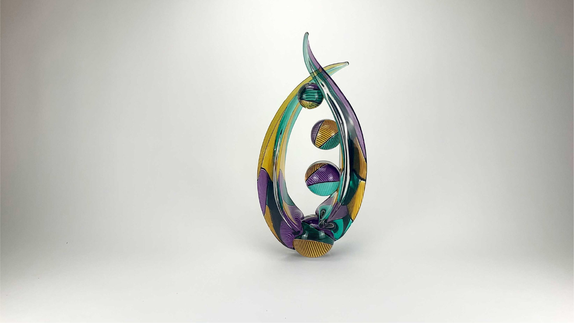 Richard-royal-Apropo-series-Desire-A21-05-MArdi-Gras-purple-gold-teal-solid-glass-sculpture